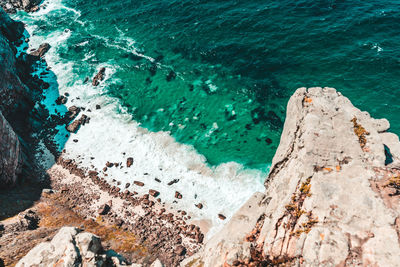 High angle view of rocks on shore