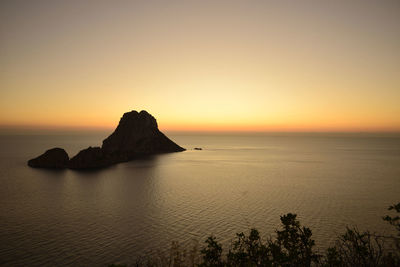 Scenic view of sea against clear sky during sunset