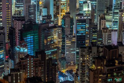 Aerial view of city lit up at night