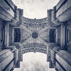 Low angle view of building against cloudy sky