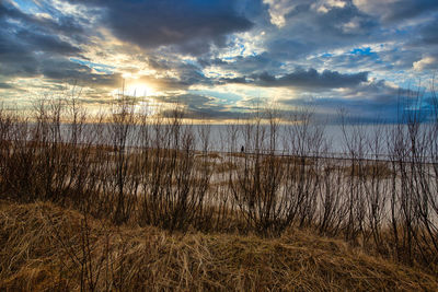 Scenic view of lake against sky during sunset