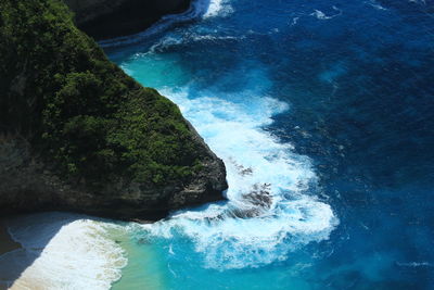 High angle view of rocks by sea