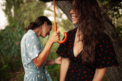 Young woman holding ice cream