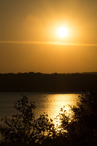 Scenic view of lake at sunset