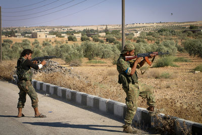 Side view of soldier standing on field