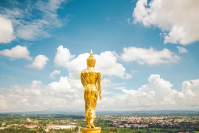 Statue of buddha against sky