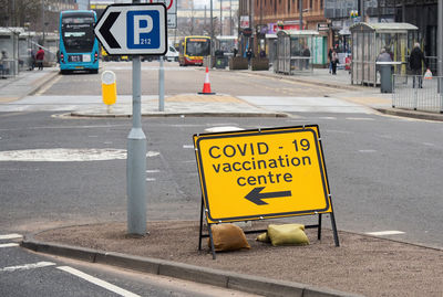 Road sign on street in city