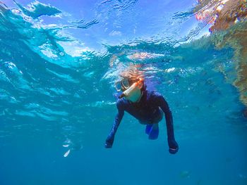 Boy swimming in sea