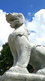 Low angle view of statue against sky
