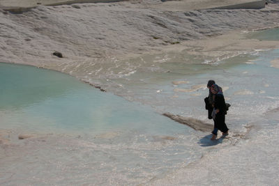 Full length of man walking on beach