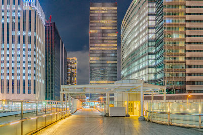 Modern buildings in city at night