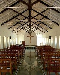 Empty chairs and tables in building