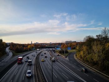 High angle view of vehicles on road against sky