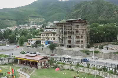 Buildings against mountain range