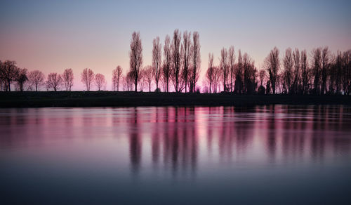 Incredible sunset on the muzza river with beautiful lights, colors and reflections