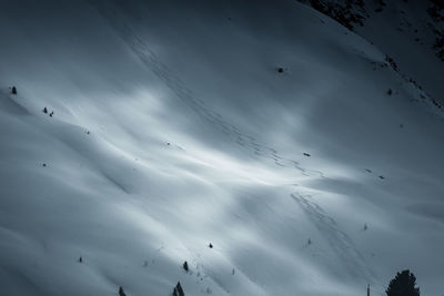 Low angle view of snowcapped mountain against sky