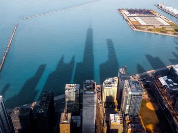 High angle view of buildings by sea