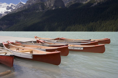 Boats moored in lake