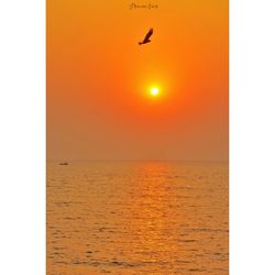 Scenic view of sea against clear sky during sunset