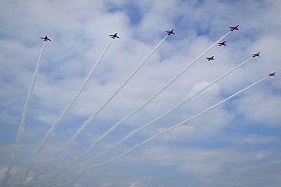 Low angle view of airplane flying against sky