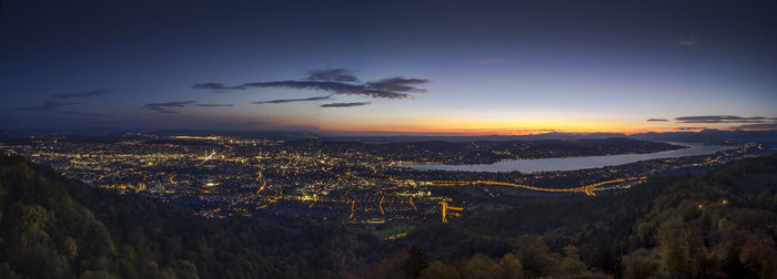 Aerial view of city against sky at sunset