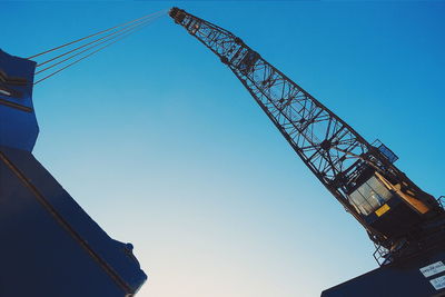 Low angle view of built structure against clear blue sky