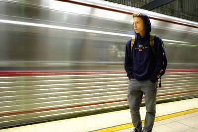 Blurred motion of train at railroad station