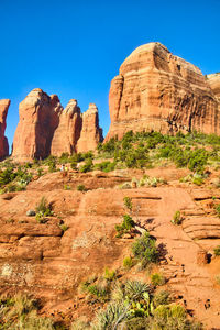 Rock formations on mountain against sky