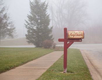 Mailbox on field during foggy weather