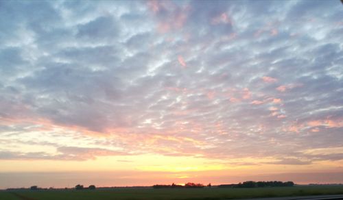 Scenic view of dramatic sky during sunset