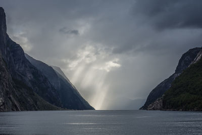 Scenic view of lysefjord and mountains against sky