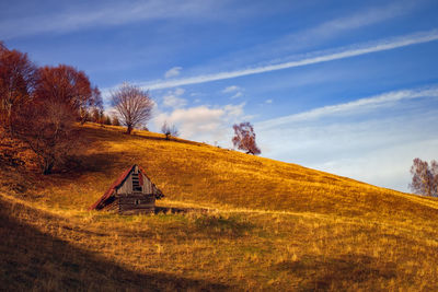 House on field against sky