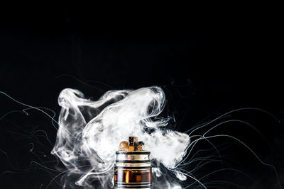Close-up of smoke against black background