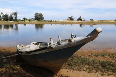 Boats moored in canal