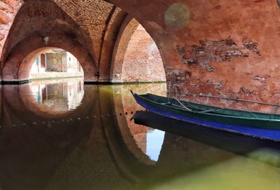 Reflection of arch bridge on canal