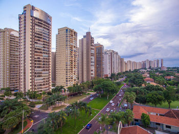 Modern buildings in city against sky