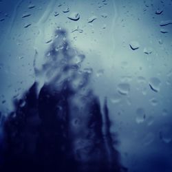 Close-up of raindrops on glass window