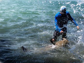 Man walking in sea