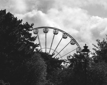 Low angle view of ferris wheel against sky