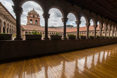 View of historic building seen through colonnade