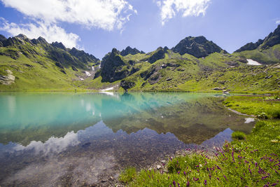 Alpine mountain lake landscape and view, blue beautiful and amazing lake reflections in okhrotskhali 