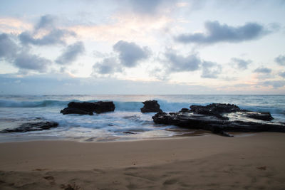 Scenic view of beach against sky