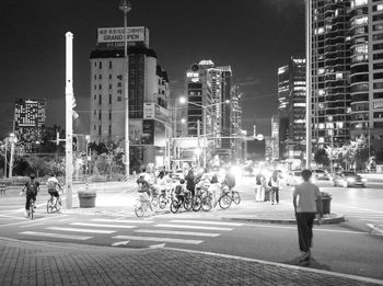 People walking on street at night