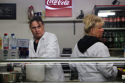 Portrait of a smiling woman in store