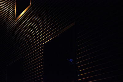 Low angle view of illuminated lighting equipment