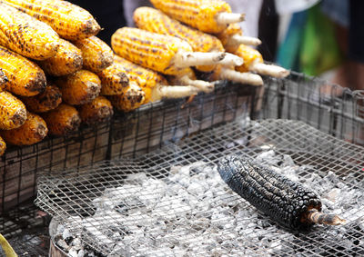 High angle view of roasted sweetcorns at market stall