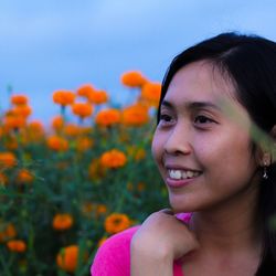 Close-up portrait of a smiling young woman