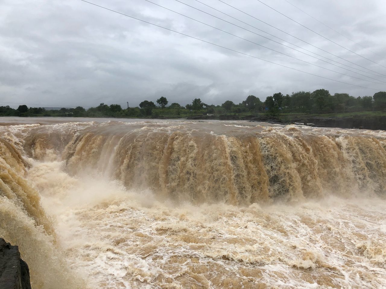 SCENIC VIEW OF WATER FLOWING THROUGH LAND