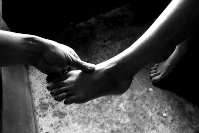 Close-up of couple holding hands