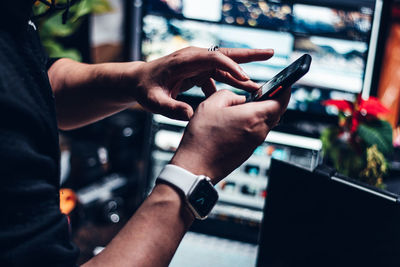 Close-up of man using mobile phone